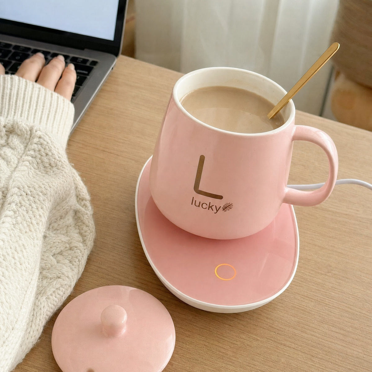 Cozy Mug in pink on its warmer